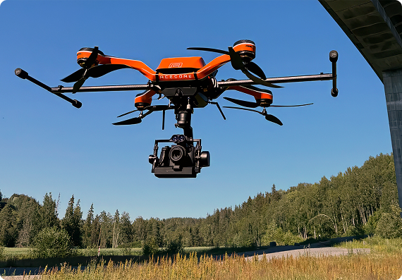Heavy-lift inspection drone with a camera gimbal in flight
